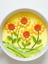 Egg dish with vegetable flowers on a white background